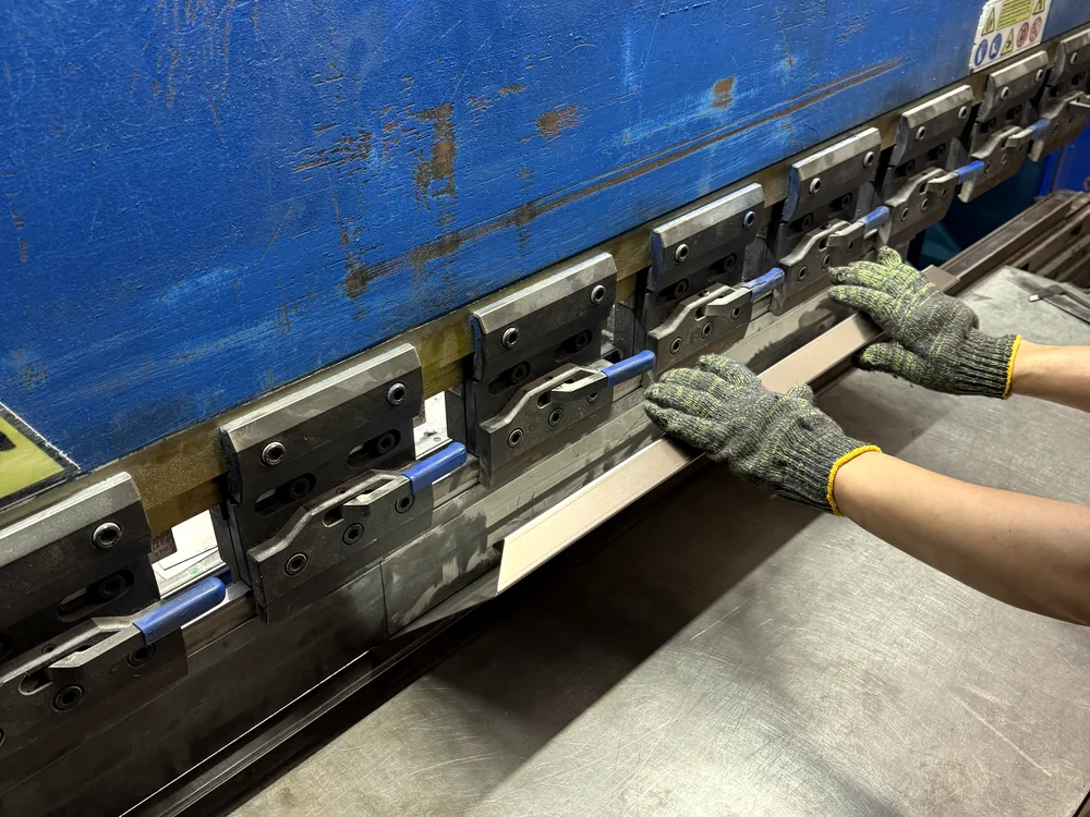 Operator forming sheet metal components for customized fire cabinets